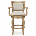 Tabouret de bar pivotant avec accoudoirs en tissu beige et bois naturel avec clous décoratifs